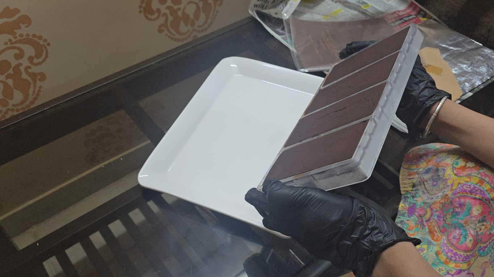 Handmade chocolate being carefully removed from its mold